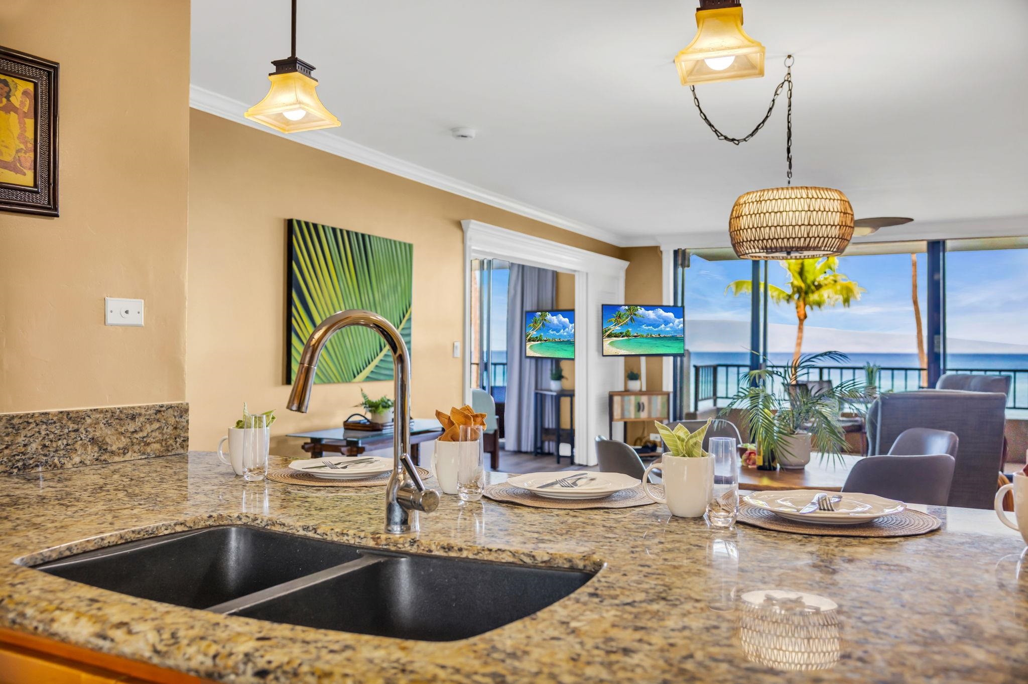 3615 Lower Honoapiilani Road, Unit 222 Lahaina, HI 96761 - Photo 6 of 50 a kitchen with a sink a counter top space and living room view
