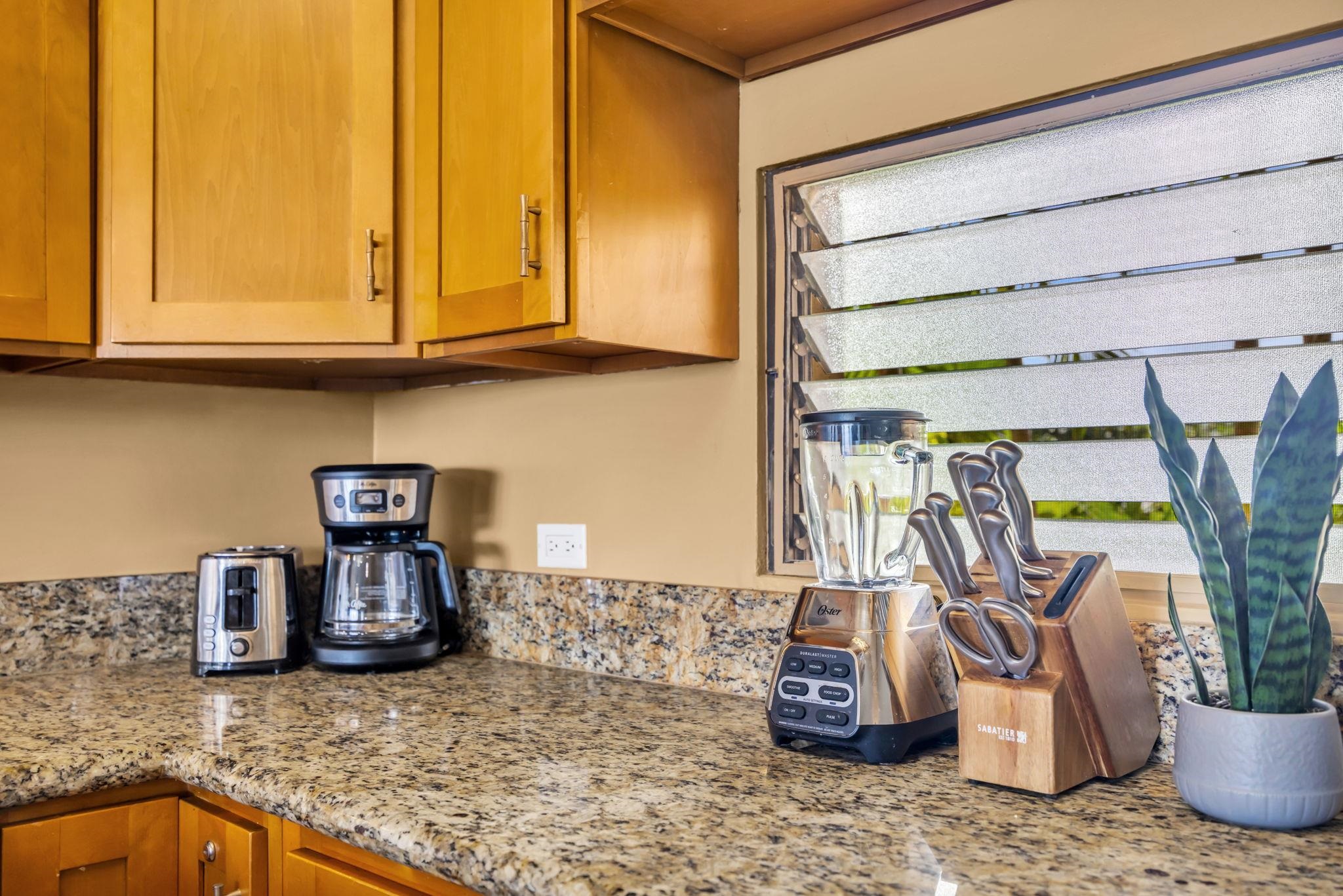 3615 Lower Honoapiilani Road, Unit 222 Lahaina, HI 96761 - Photo 7 of 50 a kitchen with a sink and a microwave
