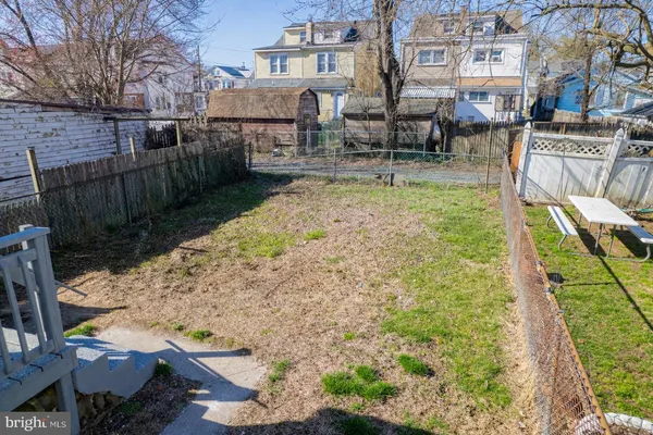 a view of a backyard with sitting area