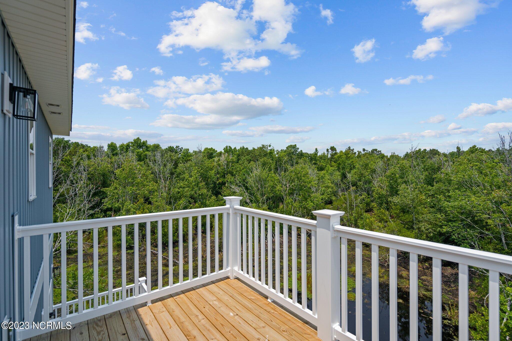279 Little Kinston Road Surf City, NC 28445 - Photo 28 of 52 Primary Bedroom Private Balcony