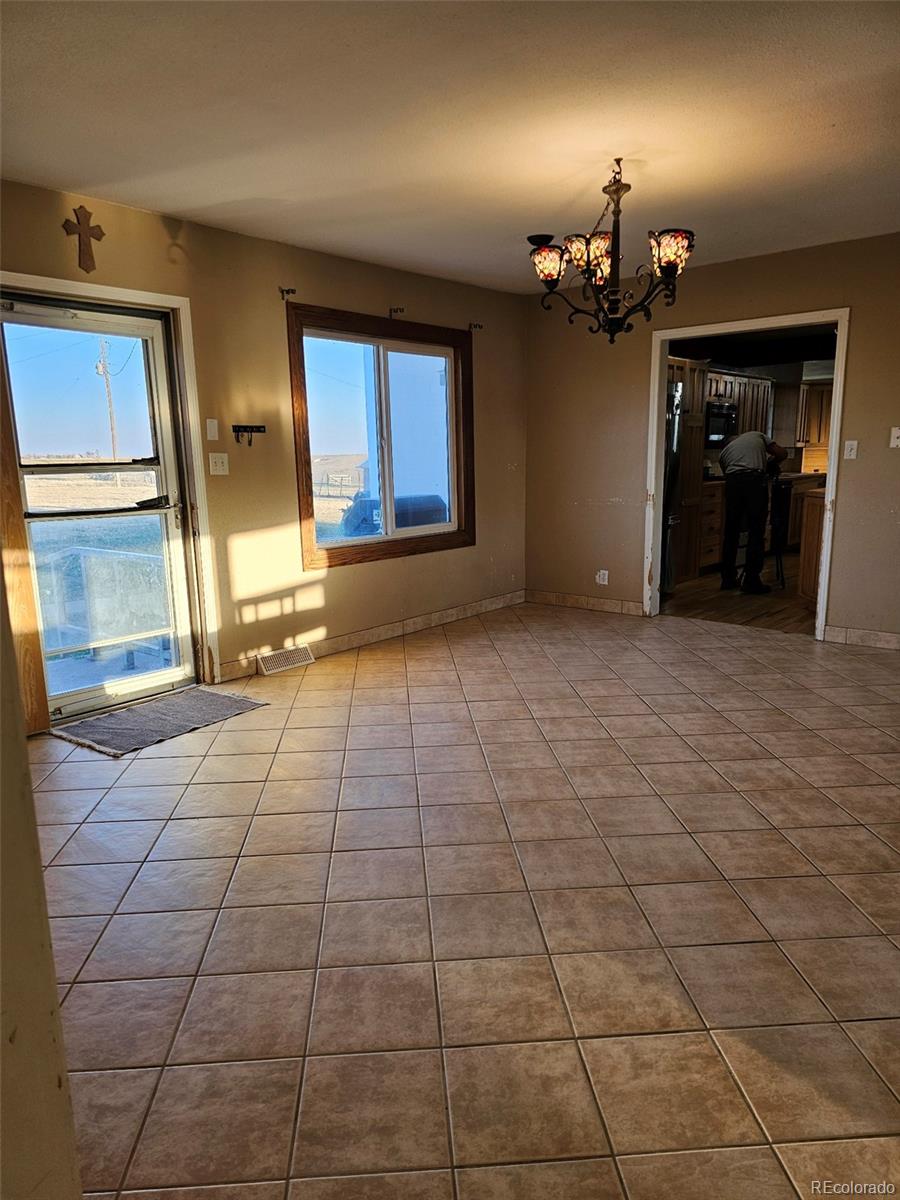 17150 County Rd PP Wray, CO 80758 - Photo 21 of 48 a view of a livingroom with furniture and an empty room