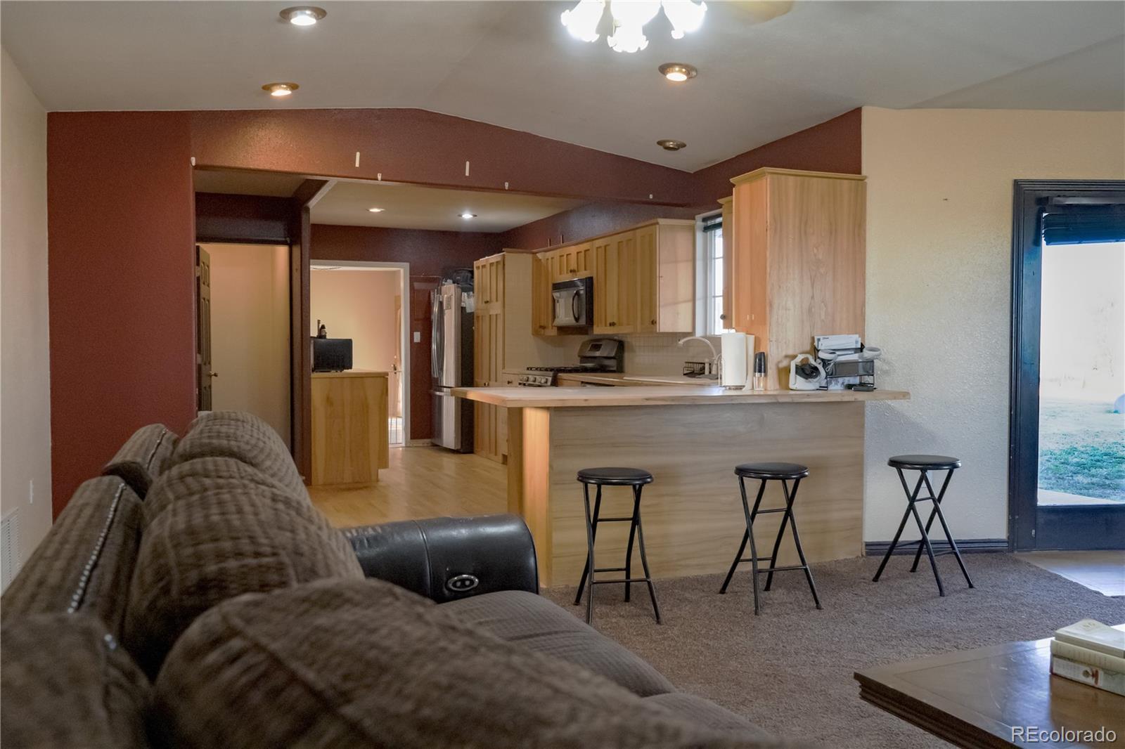 17150 County Rd PP Wray, CO 80758 - Photo 26 of 48 a living room with furniture and a table