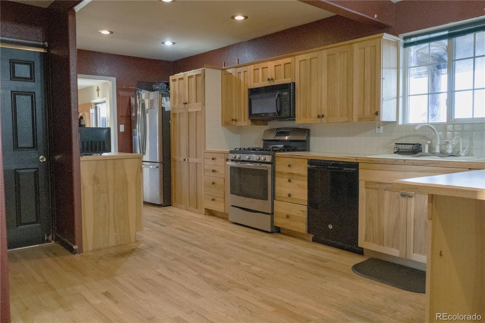 17150 County Rd PP Wray, CO 80758 - Photo 31 of 48 a kitchen with appliances cabinets and a sink
