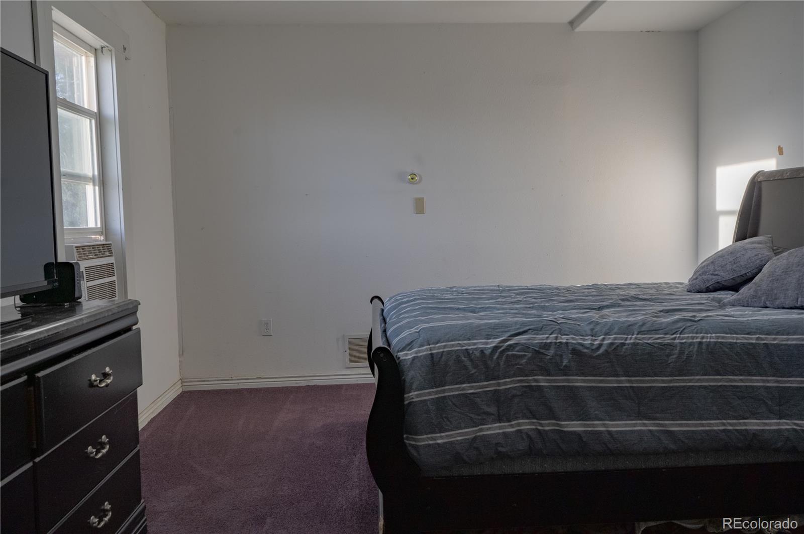 17150 County Rd PP Wray, CO 80758 - Photo 35 of 48 a bedroom with a bed and a window