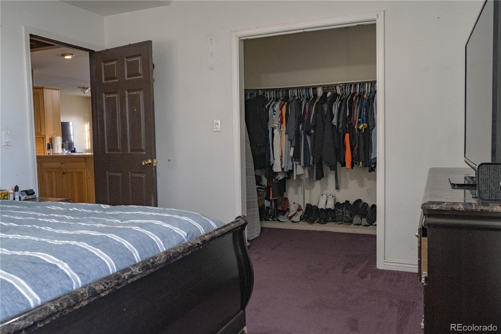 17150 County Rd PP Wray, CO 80758 - Photo 36 of 48 a bedroom with a bed and a mirror