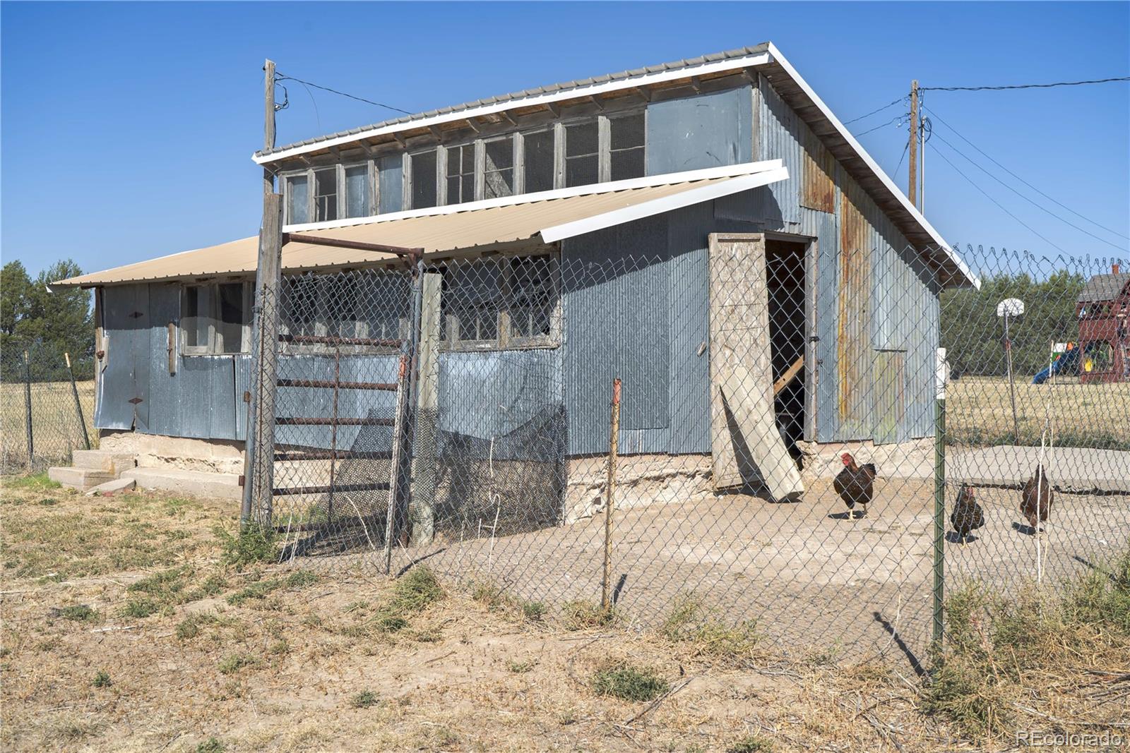 17150 County Rd PP Wray, CO 80758 - Photo 6 of 48 a front view of a house with a yard