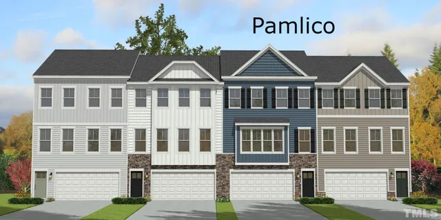 a front view of residential houses with street