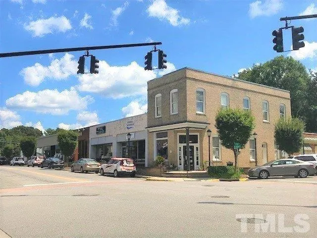 a front view of a building with street view