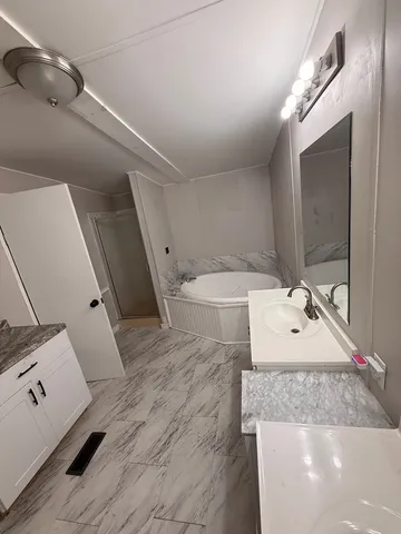a bathroom with a sink and mirror