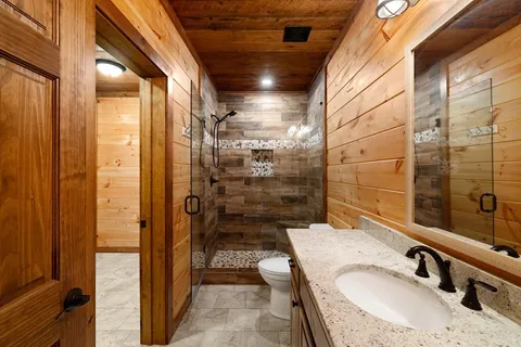 a bathroom with a glass door shower