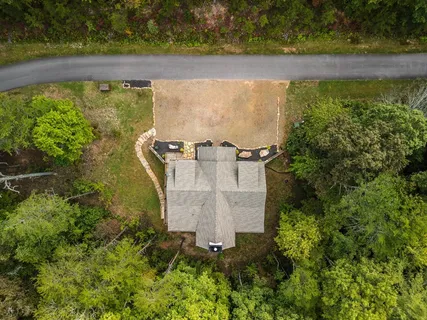 an aerial view of a house having yard