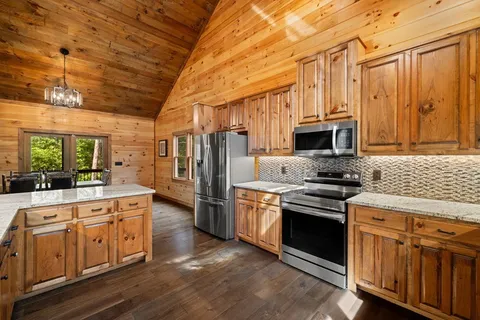 a dining room with furniture and a fireplace