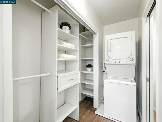a view of walk in closet with empty racks