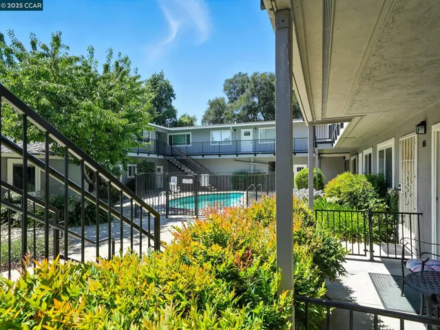a view of a balcony with chairs