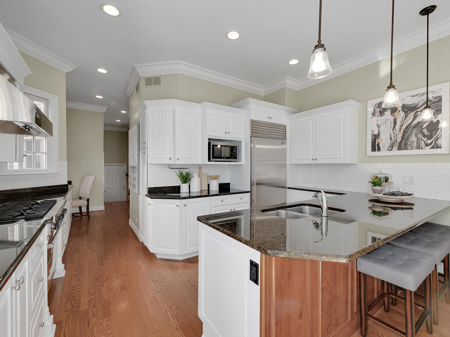 237 North County Line Road Hinsdale, IL 60521 - Photo 12 of 25 a kitchen that has a lot of cabinets a sink and appliances