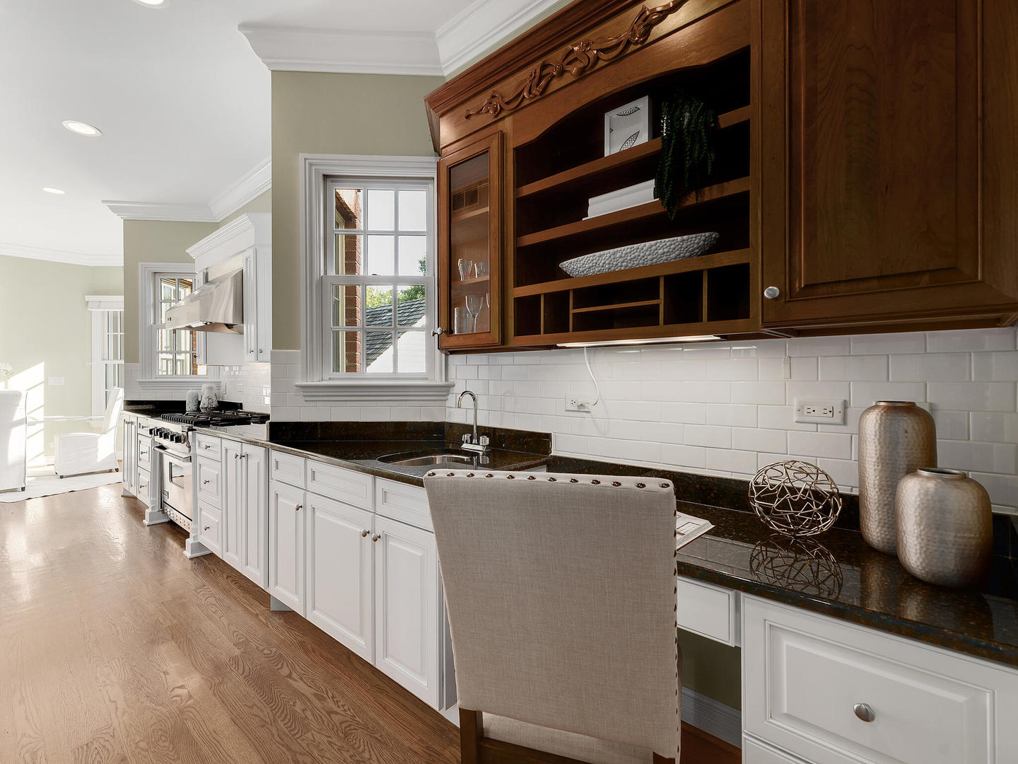 237 North County Line Road Hinsdale, IL 60521 - Photo 13 of 25 a kitchen with granite countertop a stove and cabinets