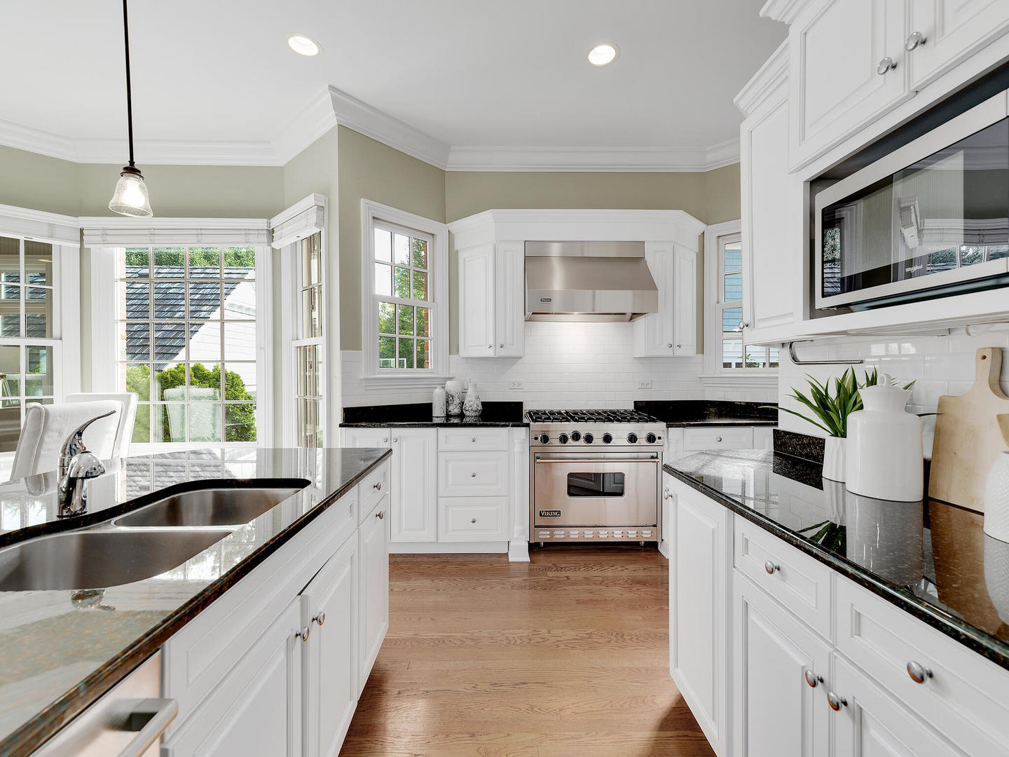 237 North County Line Road Hinsdale, IL 60521 - Photo 6 of 25 a kitchen with granite countertop white cabinets white stainless steel appliances with a sink and dishwasher