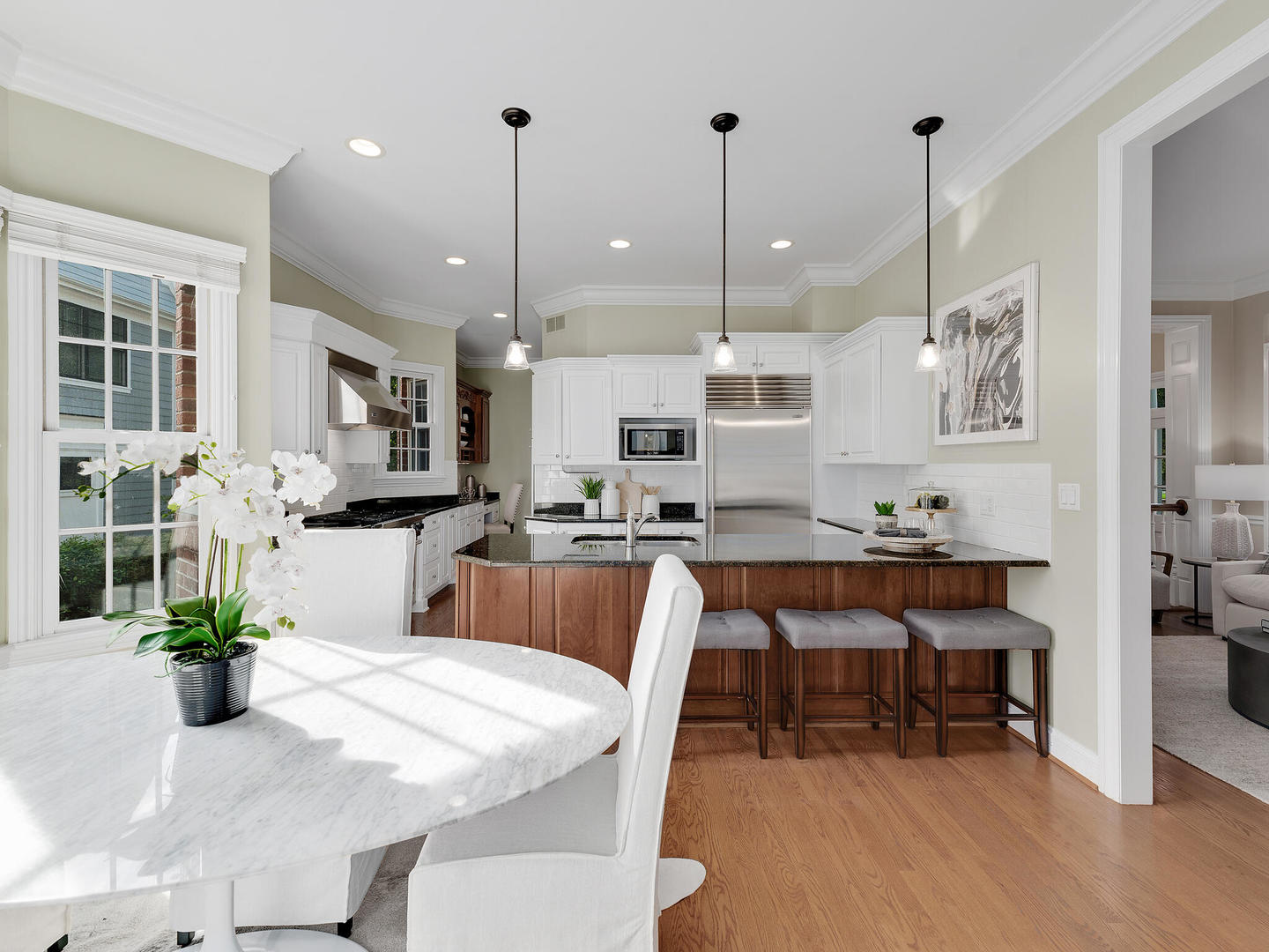237 North County Line Road Hinsdale, IL 60521 - Photo 8 of 25 a large kitchen with a table and chairs
