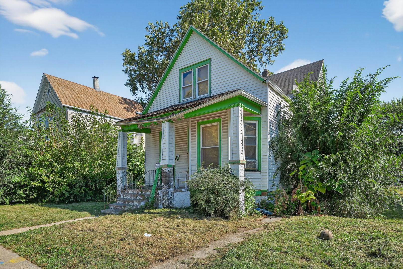 6731 South Aberdeen Street Chicago, IL 60621 - Photo 2 of 13 a front view of a house with a yard