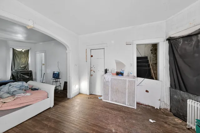 a bedroom with a bed and a couch