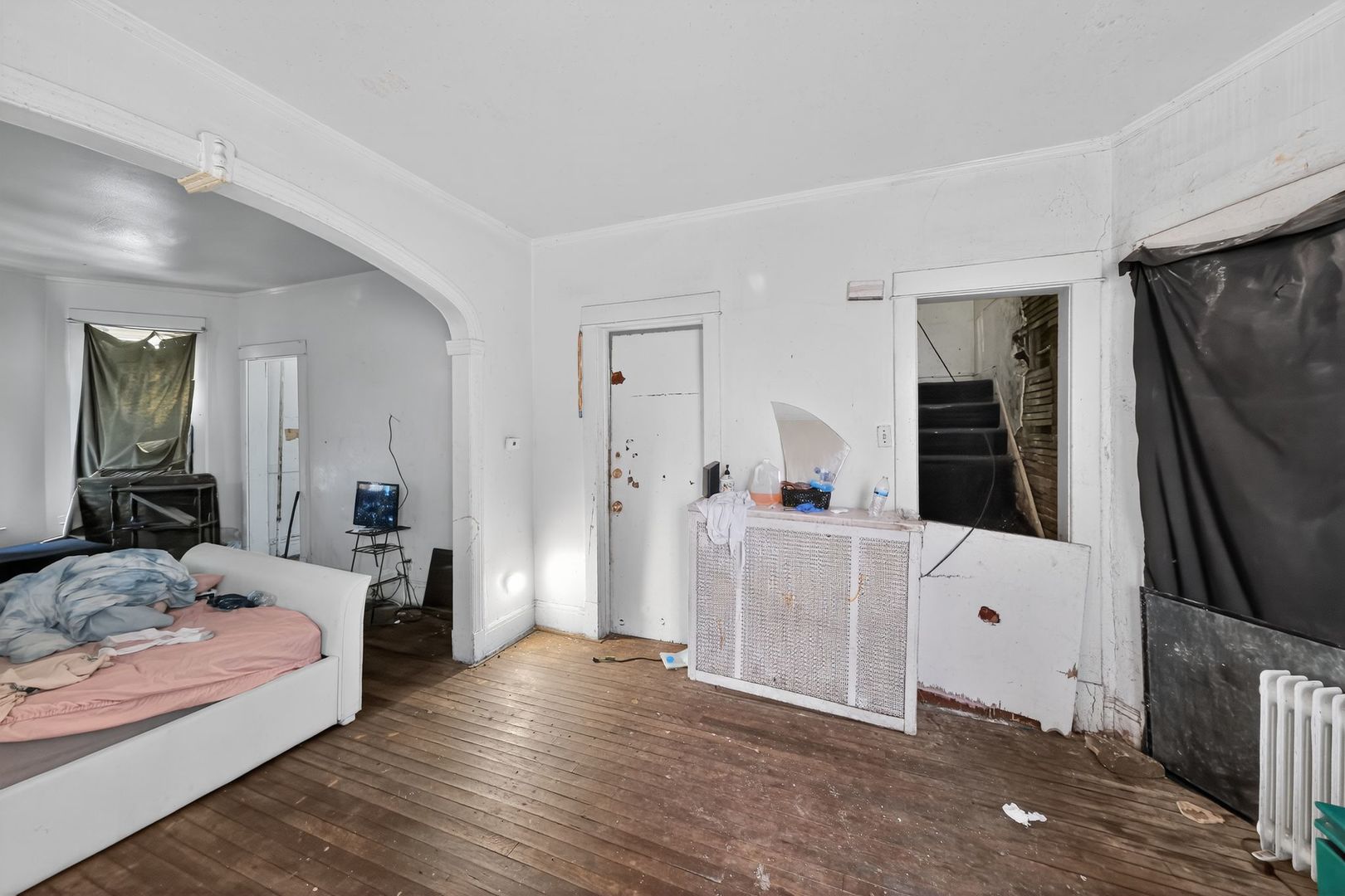 6731 South Aberdeen Street Chicago, IL 60621 - Photo 7 of 13 a bedroom with a bed and a couch