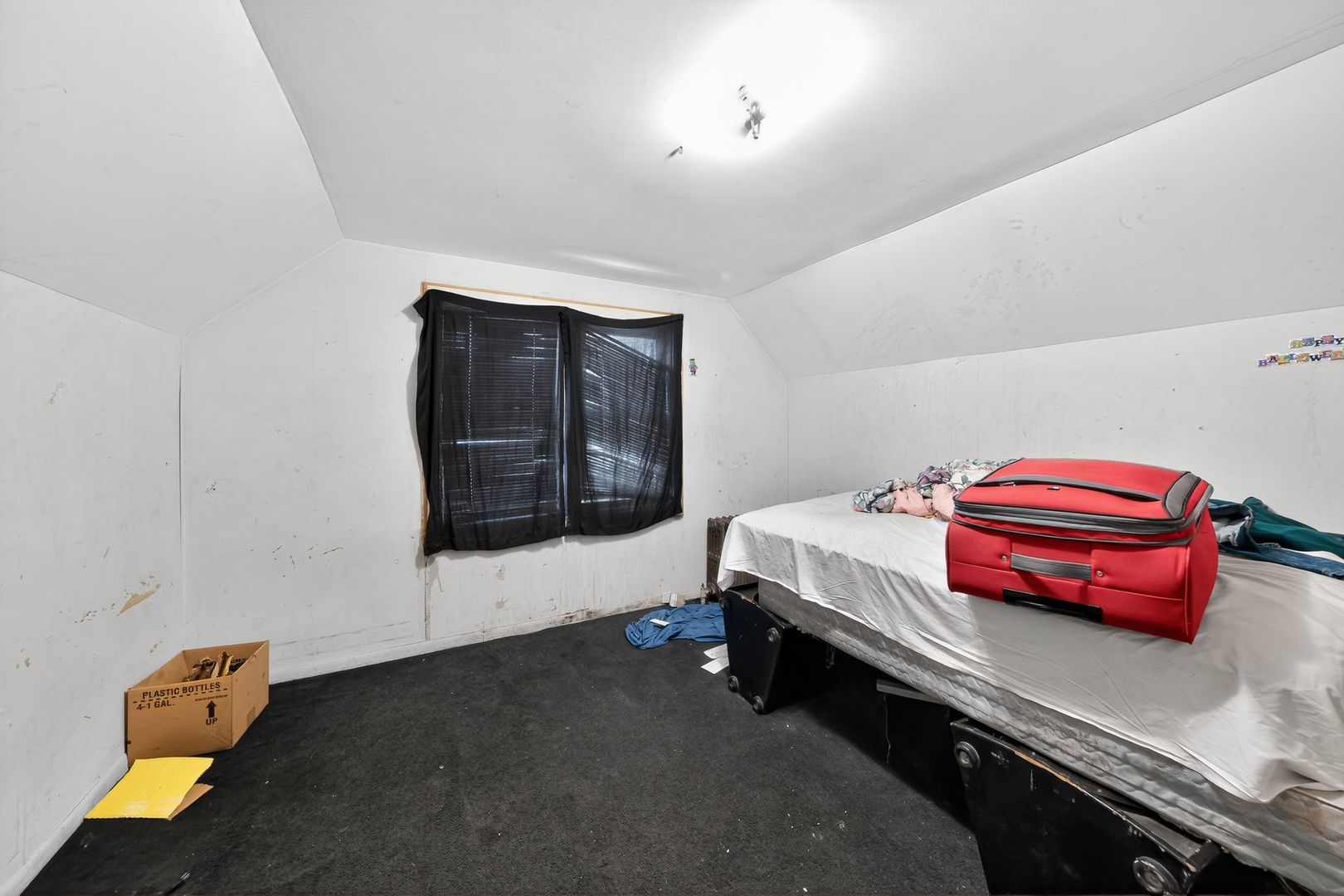 6731 South Aberdeen Street Chicago, IL 60621 - Photo 9 of 13 a room with a bed and a dresser