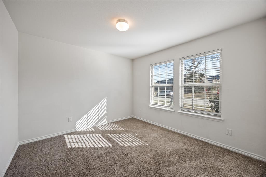 620 Gunsmoke Trail Princeton, TX 75407 - Photo 14 of 37 an empty room with windows