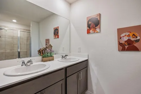 a bathroom with a sink and a mirror