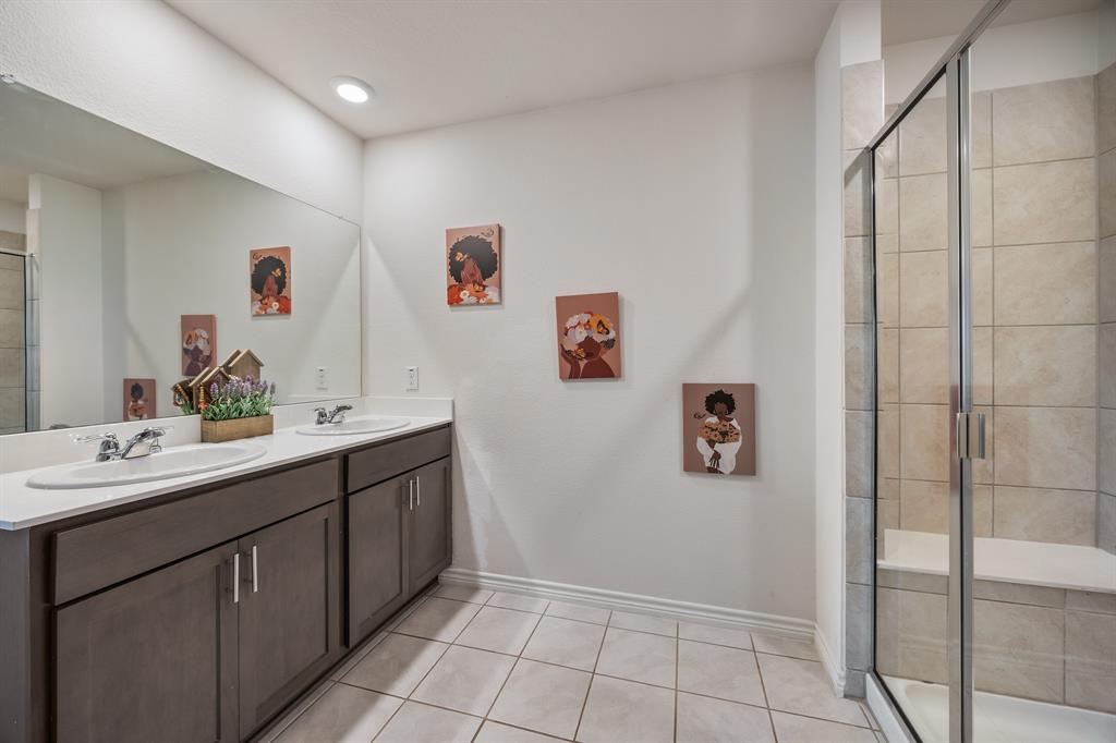 620 Gunsmoke Trail Princeton, TX 75407 - Photo 22 of 37 a bathroom with a sink mirror and vanity