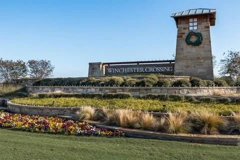 a view of a lake with a house in the background