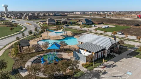 a view of a swimming pool with lawn chairs