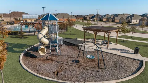 a view of a house with backyard porch and sitting area