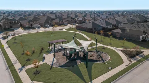 a view of a swimming pool with lawn chairs