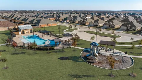 an aerial view of a house with outdoor space