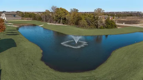a view of a swimming pool with a lake view