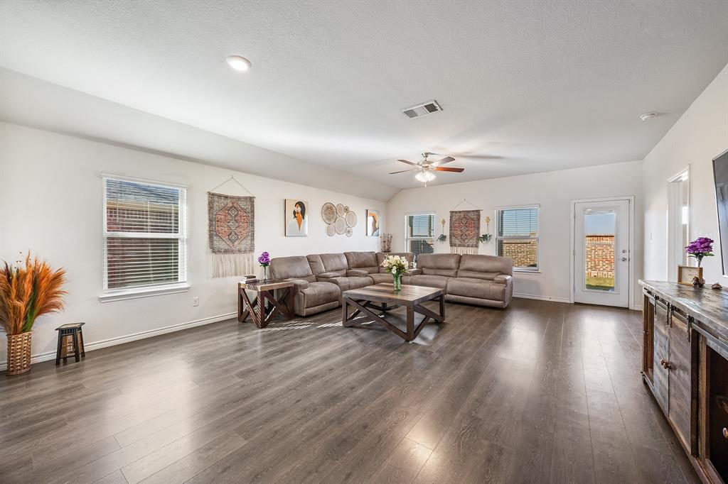 620 Gunsmoke Trail Princeton, TX 75407 - Photo 4 of 37 a living room with furniture and a wooden floor