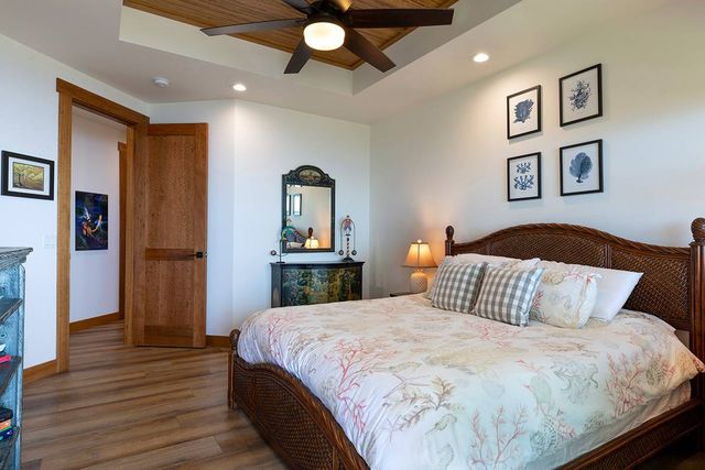 a bedroom with a bed and a view of bathroom