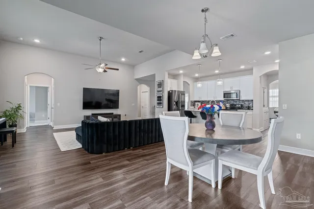 a kitchen with a sink a counter space and a refrigerator