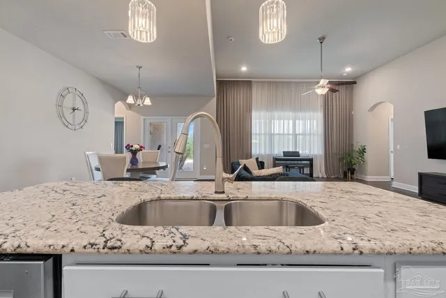 a bathroom with a sink a vanity and a mirror