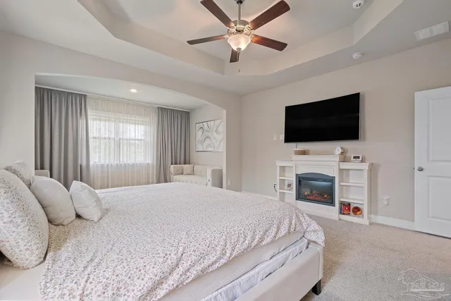 a view of walk in closet with clothes