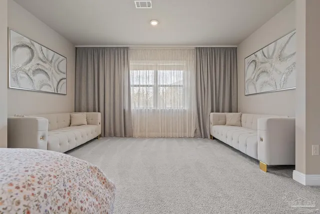 a room that has a bed and a bathroom in it