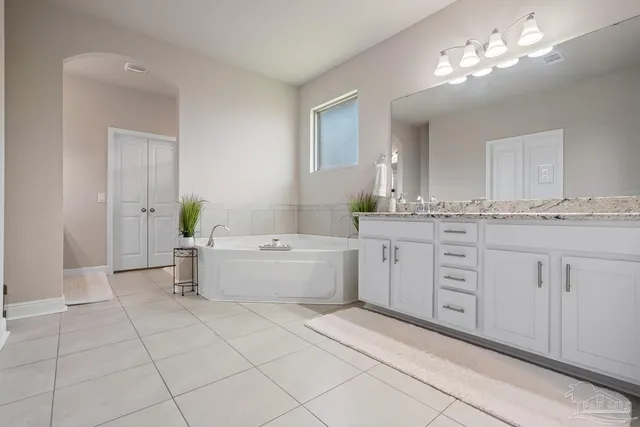 a bedroom with a bed and a table