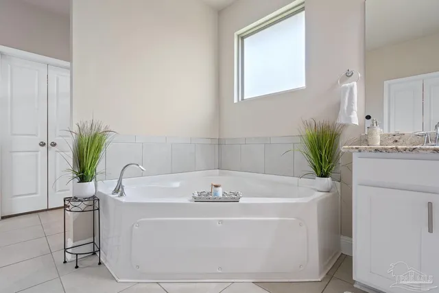 a white toilet sitting next to a bath tub