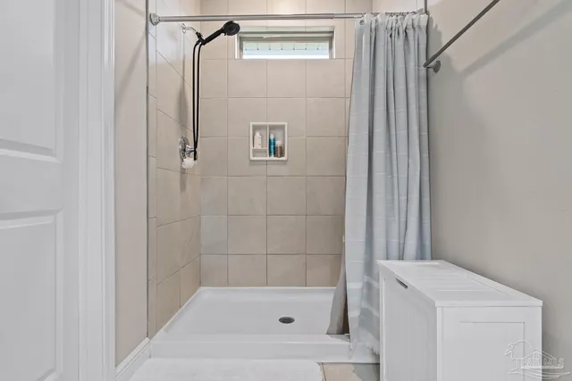 a bedroom with a bed and a chair