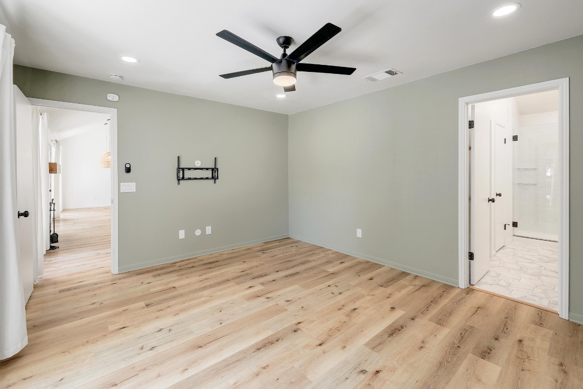 1205 Rambling Trail Cedar Park, TX 78613 - Photo 14 of 38 Primary suite facing bathroom entry and entry to living room.
