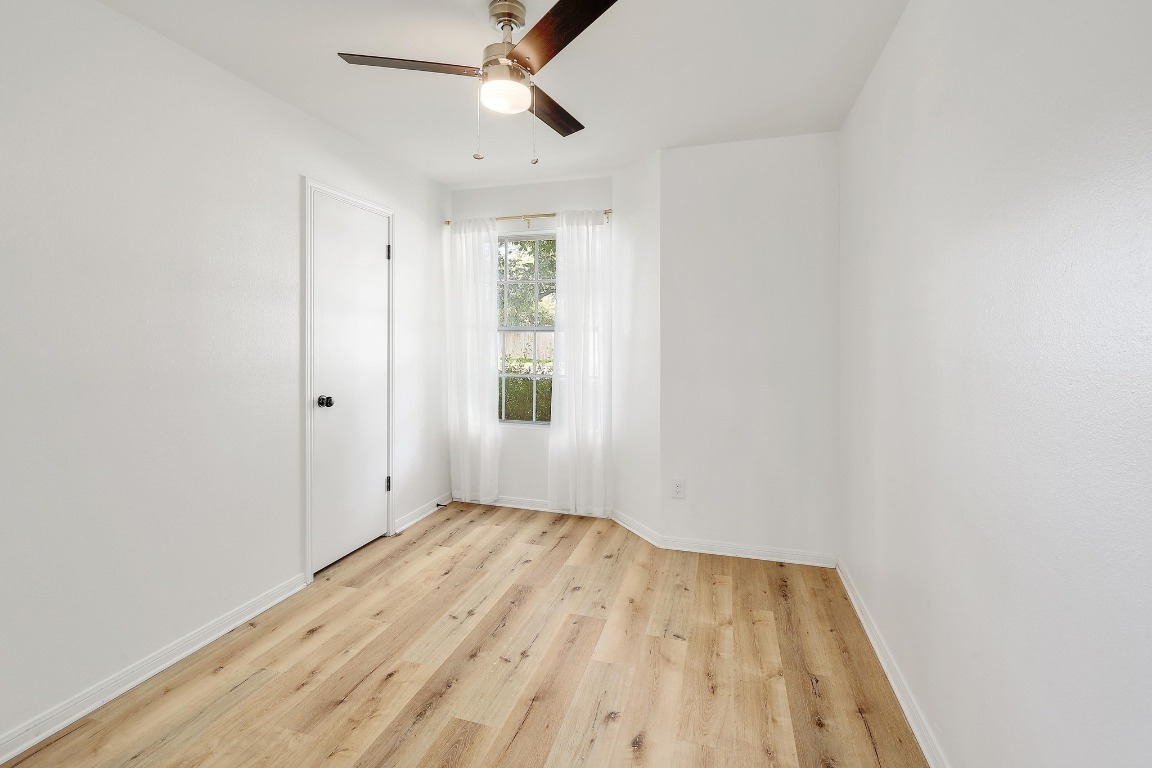 1205 Rambling Trail Cedar Park, TX 78613 - Photo 18 of 38 Bedroom off front of home featuring ceiling fan and step-in closet.