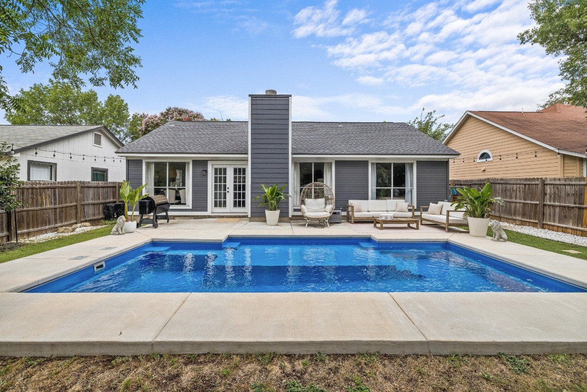 1205 Rambling Trail Cedar Park, TX 78613 - Photo 2 of 38 Rear view of property with french doors, an outdoor living space, and a fenced backyard.