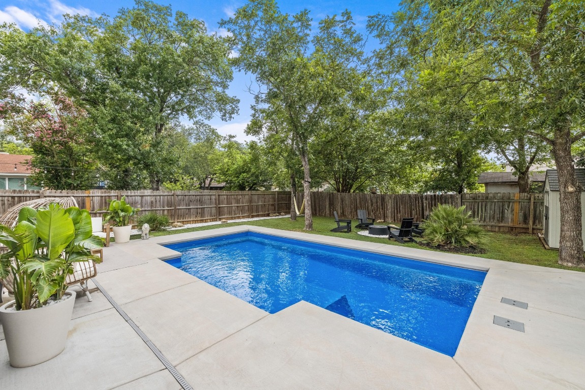 1205 Rambling Trail Cedar Park, TX 78613 - Photo 26 of 38 View of pool, patio, and yard from rear french doors.