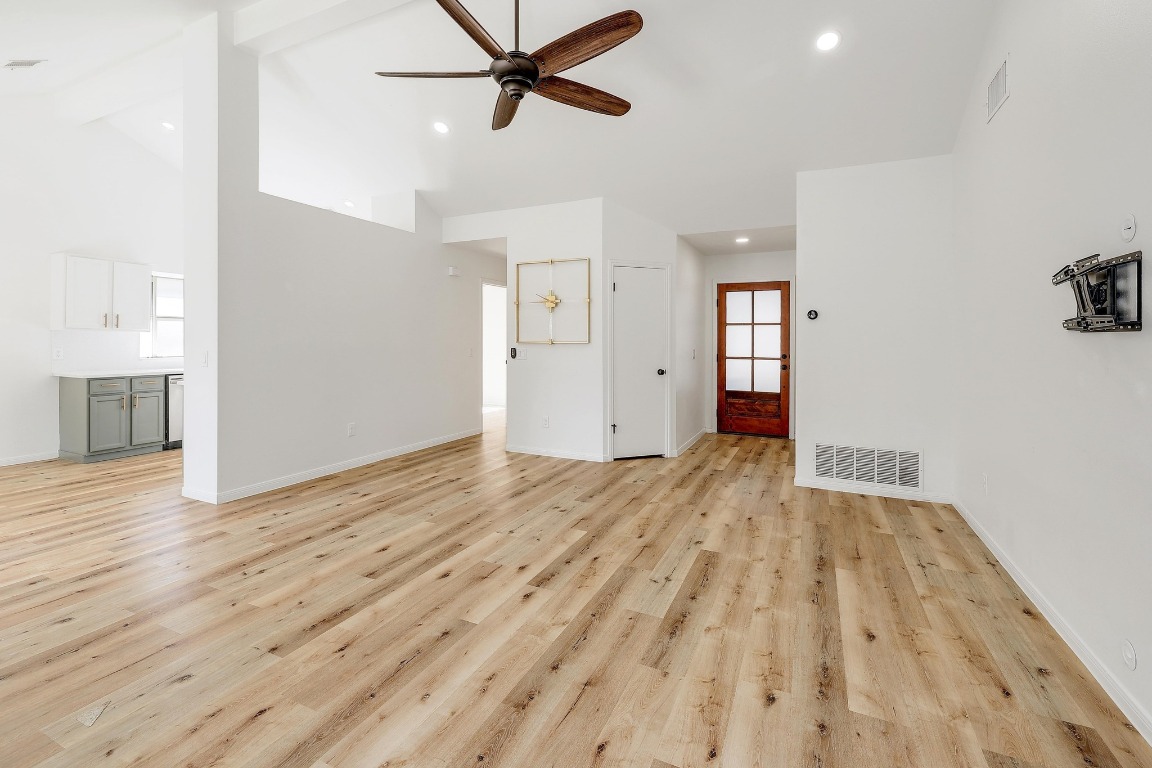 1205 Rambling Trail Cedar Park, TX 78613 - Photo 7 of 38 Central living room open to dining area and partially open to kitchen. Luxury vinyl plank flooring with white oak finish.