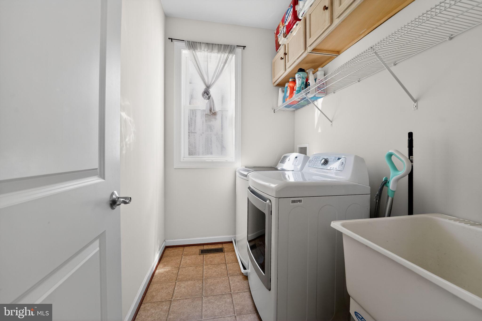 12039 Open Run Road Ellicott City, MD 21042 - Photo 28 of 67 Bright and functional laundry space.